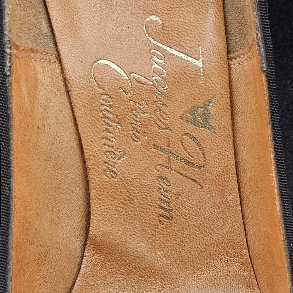 Jacques Heim pumps with a rhinestone-embellished toe.